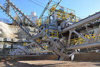 The rakes and bucket wheel remove material uniformly from the pile. (Source: SBM Mineral Processing)