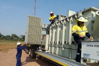 Detachable type transformer radiators being lowered into position for connection to the main transformer tank. The transformer employs an ONAN/ONAF type cooling system, achieving a maximum rating of 18 MVA.