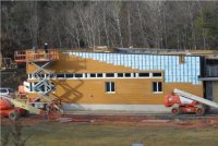 The project team promoted recycling during design and construction. Recycled construction materials included the fiber cement siding and the ground faced block used at the foundation (shown). The project was built using more than 20 percent recycled materials. The contractor achieved nearly 75 percent recycle or reuse of materials.