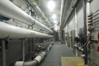 The HVAC system at the Madbury Water Treatment Plant uses process water for the heat pumps. As in a ground source heating system, the heat exchangers (shown) use incoming process water as a heat sink during summer months and as a heat source in fall and spring. Modeling shows total energy savings of more than 25 percent versus a conventional DAF plant.